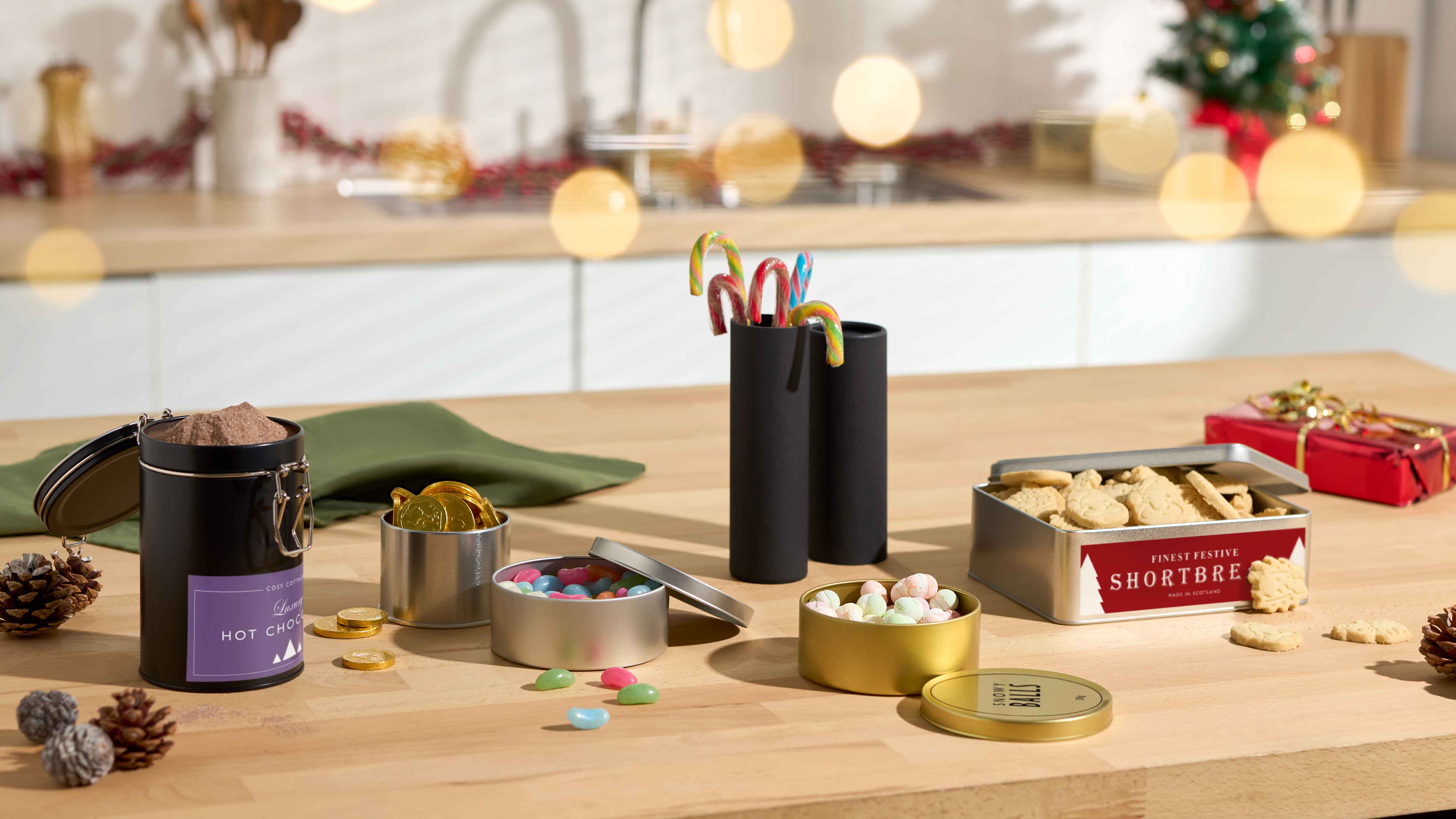 Selection of sweet packaging in kitchen with festive decor