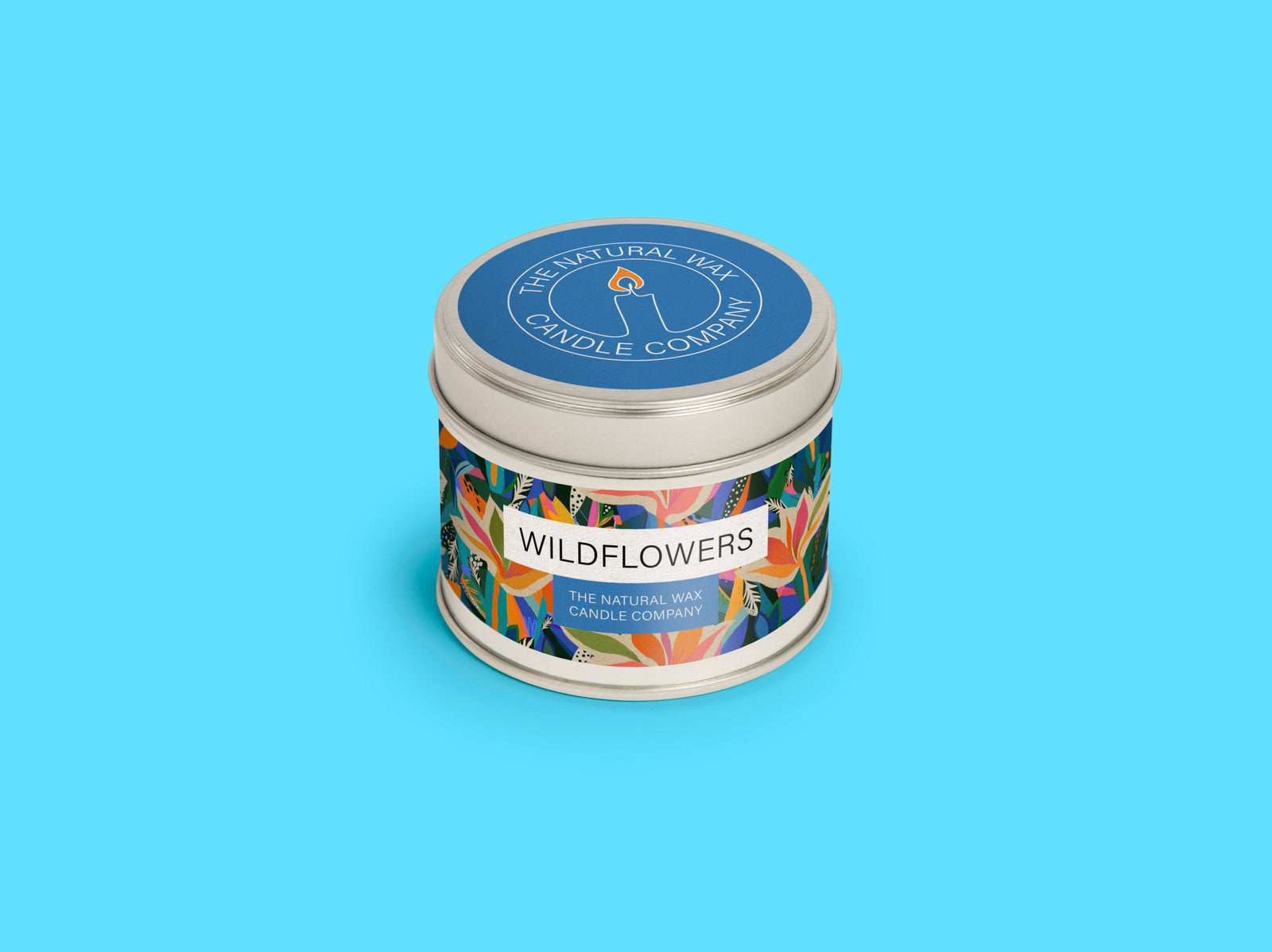 Metal candle tin packaging on blue background.