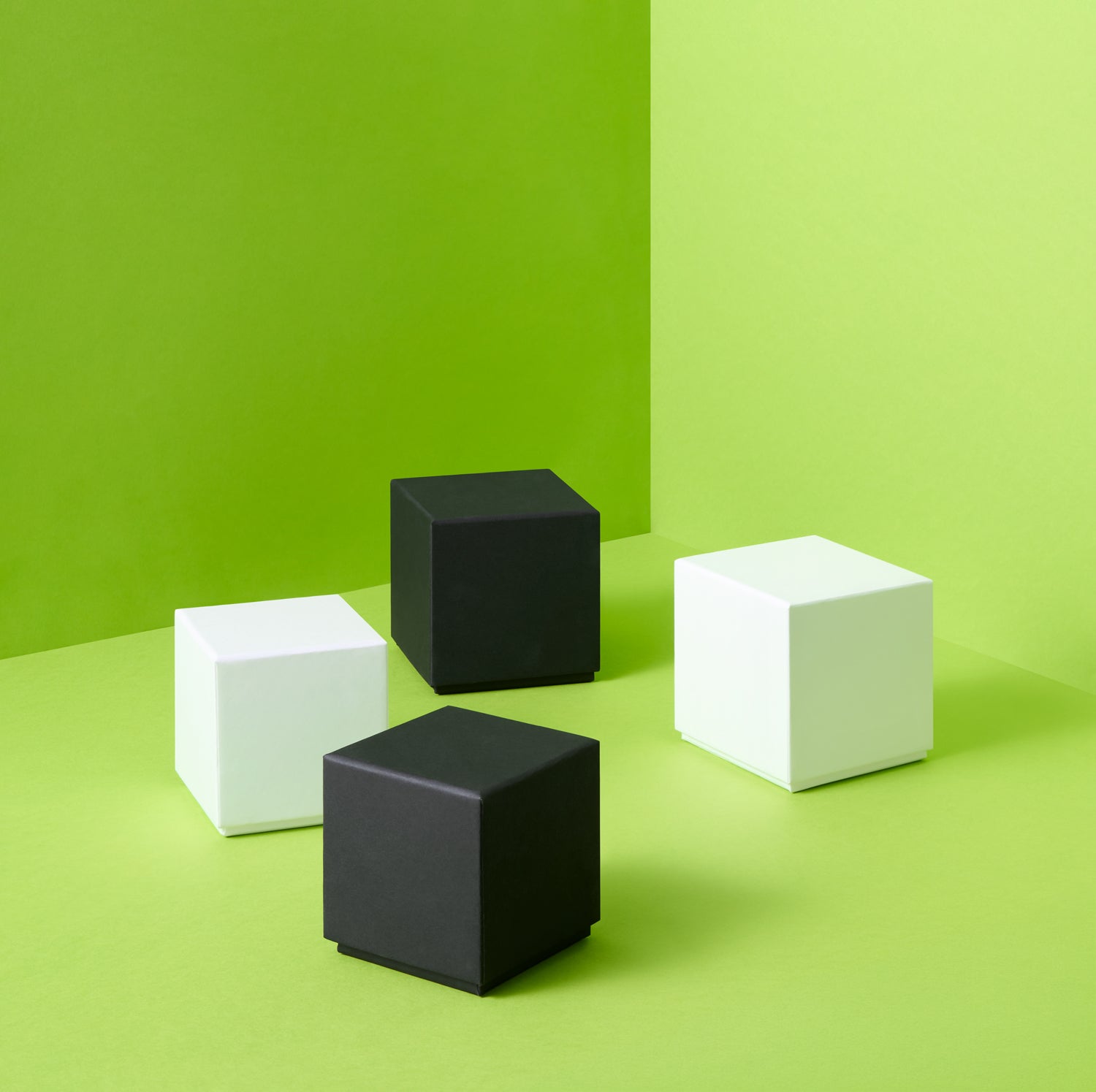 Collection of white and black square boxes on a green background.